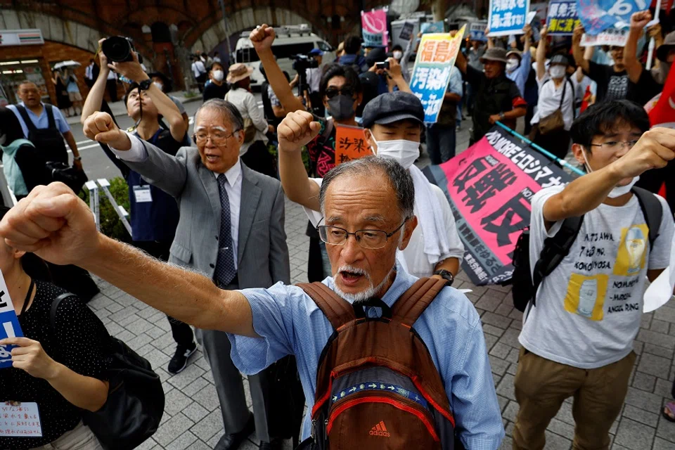 Protestors attend a rally against Japan's plan to discharge treated radioactive water from the crippled Fukushima Daiichi nuclear plant into the ocean, in front of the headquarters of Tokyo Electric Power Company (TEPCO), the operator of the nuclear plant in Tokyo, Japan, on 24 August 2023. (Kim Kyung-Hoon/Reuters)