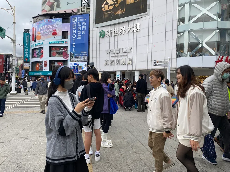 People walk in the Ximending shopping district in Taiwan. (SPH Media)