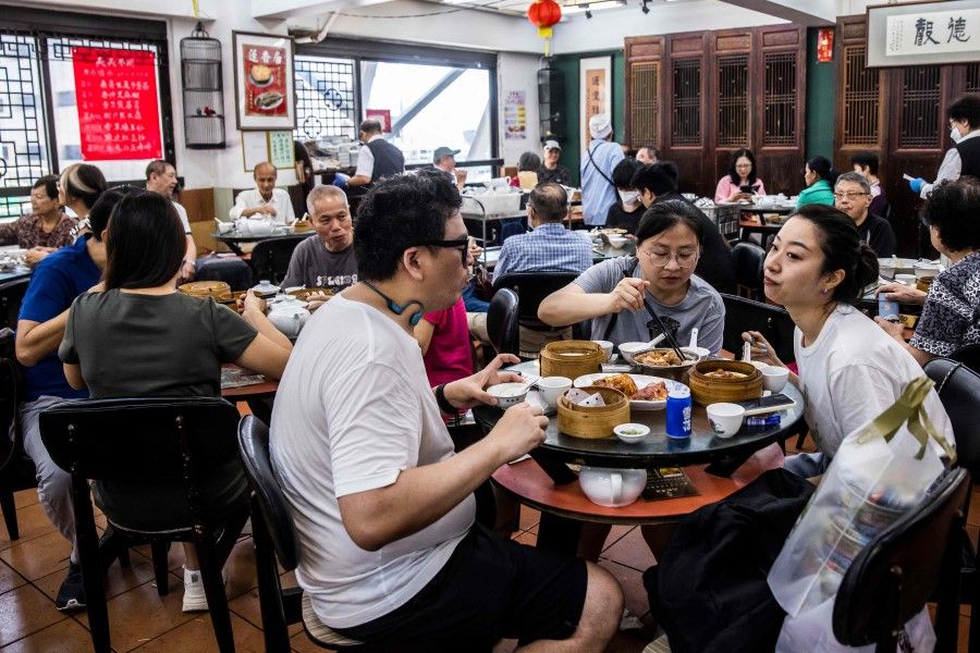 Diners at a dim sum restaurant in Hong Kong, 8 June 2023. (Isaac Lawrence/AFP)