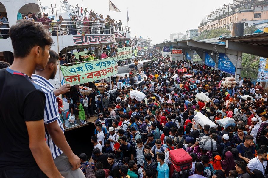 People gather at the Sadarghat Ferry Terminal as they leave Dhaka to celebrate Eid al-Fitr at home with family, in Dhaka, Bangladesh, on 20 April 2023. (Mohammad Ponir Hossain/Reuters)