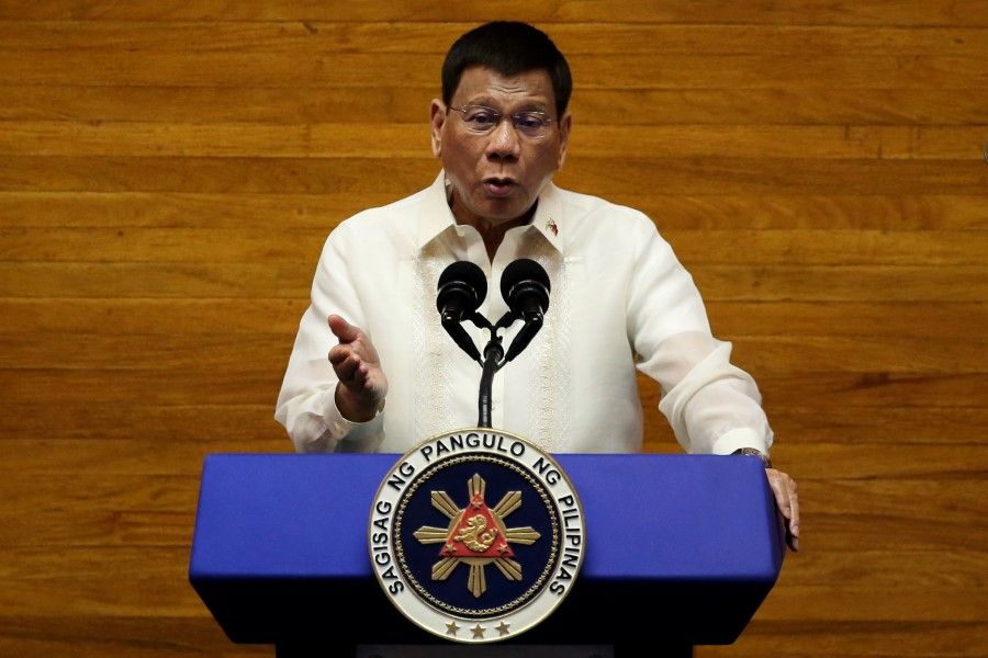 Philippine President Rodrigo Duterte gestures as he delivers his 6th State of the Nation Address (SONA), at the House of Representative in Quezon City, Metro Manila, Philippines, 26 July 2021. (Lisa Marie David/Reuters)