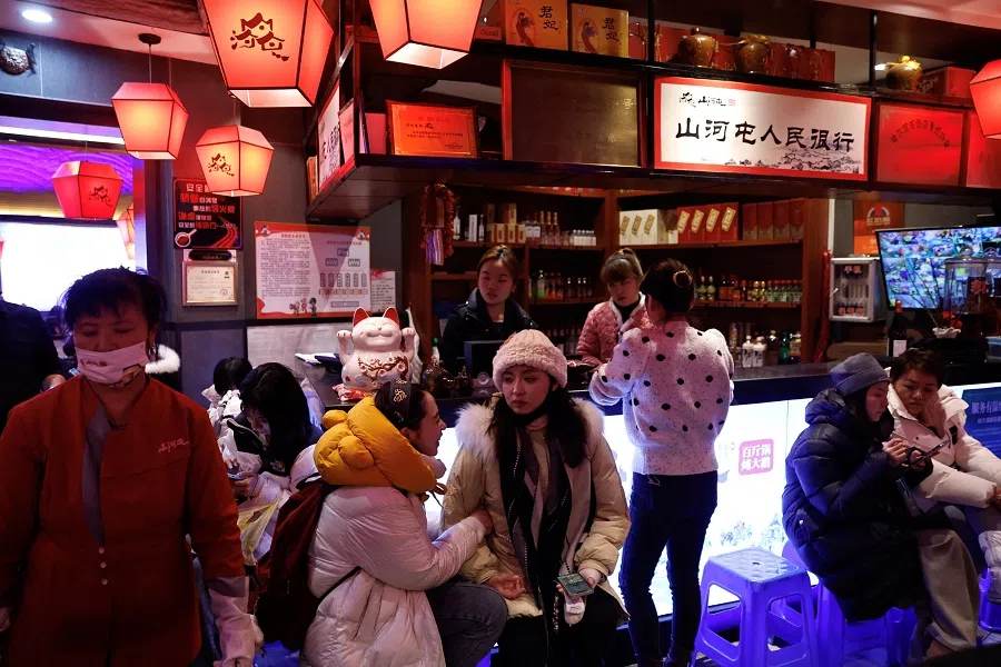 Customers wait for tables at a restaurant in Harbin, Heilongjiang province, China, on 6 January 2024. (Tingshu Wang/Reuters)