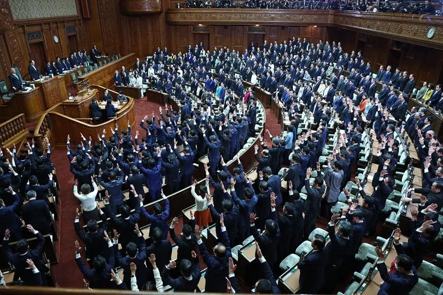 Lawmakers cheer as the House of Representatives is dissolved at the Diet in Tokyo on 23 January 23 2026. (JIJI Press/AFP)