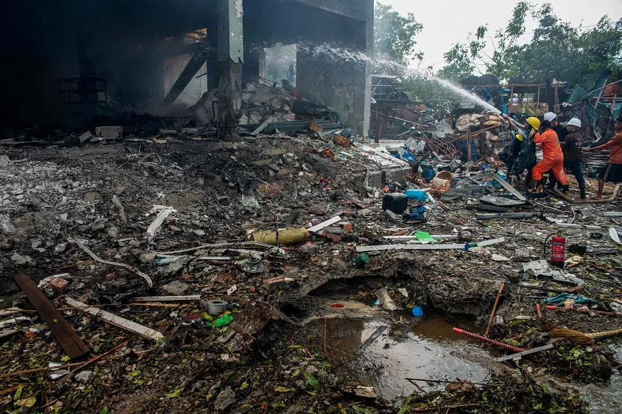 Firefighters extinguish a fire in a building that was destroyed in a bombardment carried out by Myanmar’s military in Thabeikkyin Township in the Mandalay region of Central Myanmar on 19 April 2025.