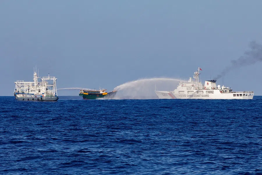 Chinese Coast Guard vessels fire water cannons towards a Philippine resupply vessel Unaizah May 4 on its way to a resupply mission at Second Thomas Shoal in the South China Sea on 5 March 2024. (Adrian Portugal/Reuters)