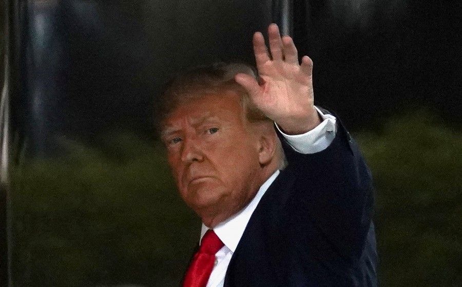 Former US President Donald Trump arrives at Trump Tower, after his indictment by a Manhattan grand jury following a probe into hush money paid to porn star Stormy Daniels, in New York City, US, 3 April 2023. (David Dee Delgado/Reuters)