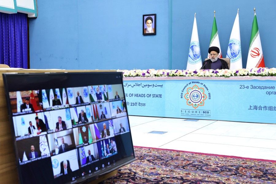 Iranian President Ebrahim Raisi attends the 23rd Shanghai Cooperation Organisation Council of Heads of State (SCO) Summit via video link at the Office of the President of Iran, in Tehran, Iran, 4 July 2023. (Iran's Presidency/WANA (West Asia News Agency)/Handout via Reuters)
