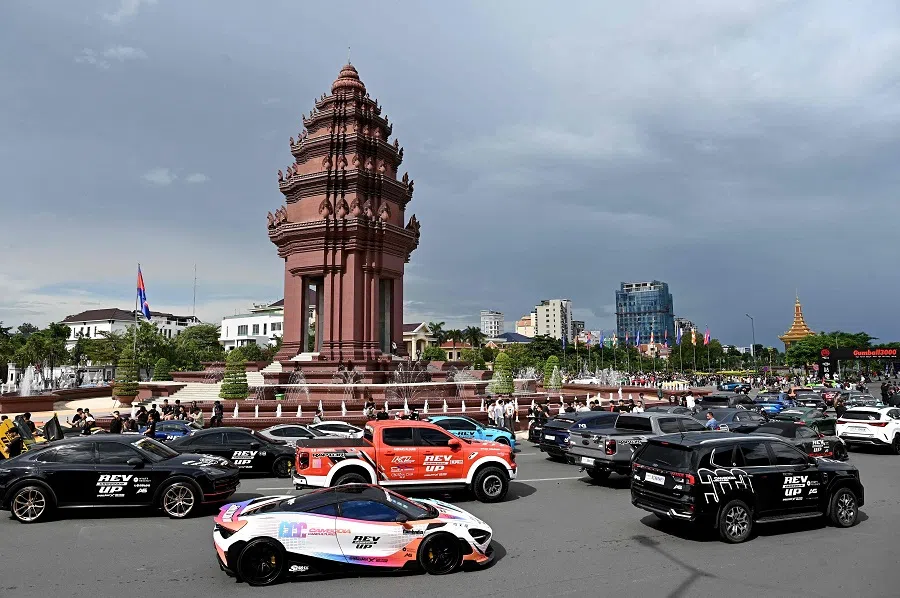 Supercars are parked around the Independence Monument during the Gumball 3000 rally in Phnom Penh on 15 September 2024. (Tang Chhin Sothy/AFP)