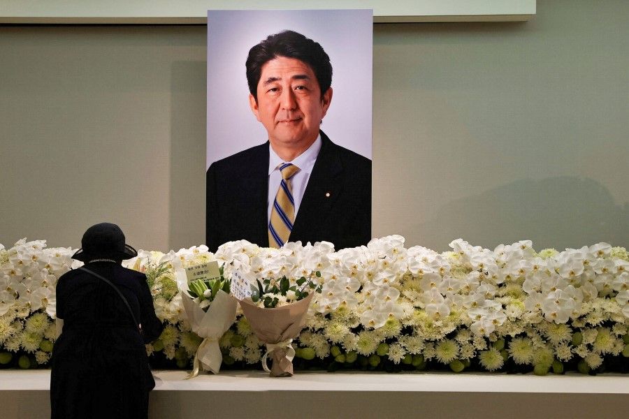 A mourner pays respects to late former Japanese Prime Minister Shinzo Abe, who was shot while campaigning for a parliamentary election, in Taipei, Taiwan, 11 July 2022. (Ann Wang/Reuters)