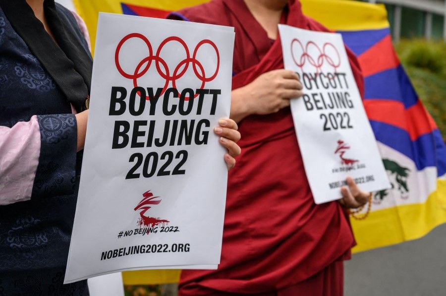 Tibetan activists stand in front of the International Olympic Committee (IOC) headquarters during a protest ahead of the February's Beijing 2022 Winter Olympics, on 26 November 2021 in Lausanne. (Fabrice Coffrini/AFP)