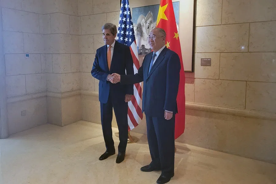 US Special Presidential Envoy for Climate John Kerry shakes hands with his Chinese counterpart Xie Zhenhua before a meeting in Beijing, China, 17 July 2023. (Valerie Volcovici/Reuters)