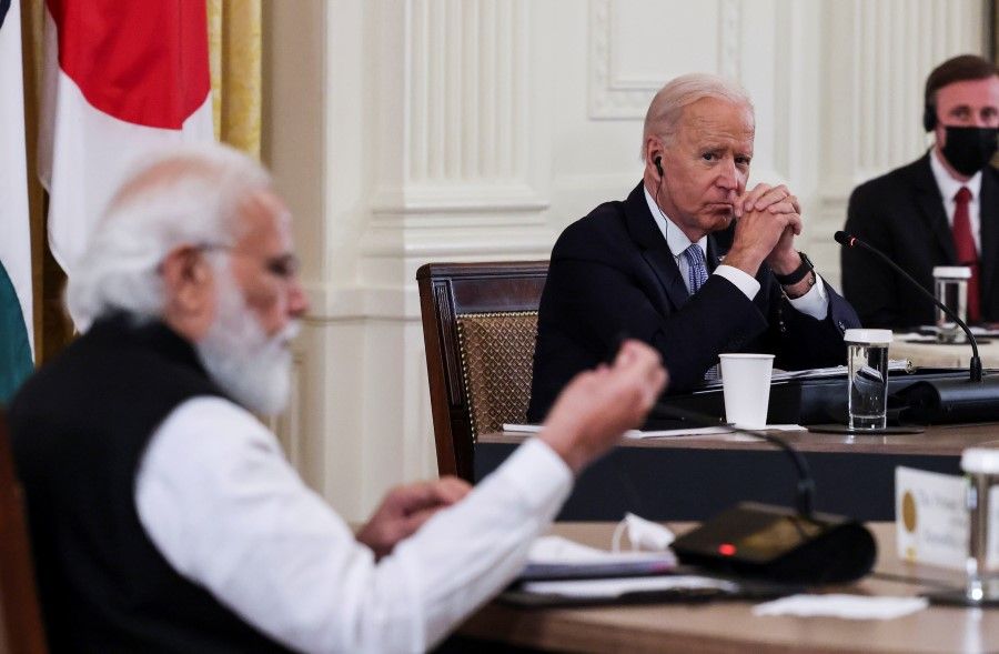 US President Joe Biden listens as India's Prime Minister Narendra Modi speaks during a 'Quad nations' meeting at the Leaders' Summit of the Quadrilateral Framework held in the East Room at the White House in Washington, US, 24 September 2021. (Evelyn Hockstein/Reuters)