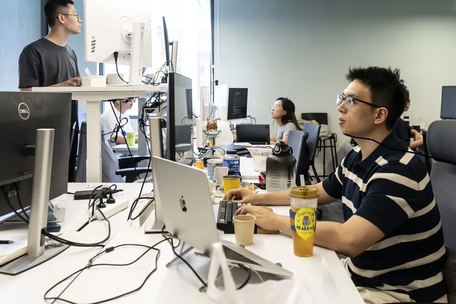 AI engineers work in a room at Bota Biosciences Ltd. in Hangzhou, China, on 6 July 2026.