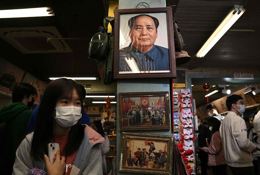 A picture of the late communist leader Mao Zedong hangs at a store at Nanluoguxiang in Beijing, China, on 3 October 2022. (Noel Celis/AFP)