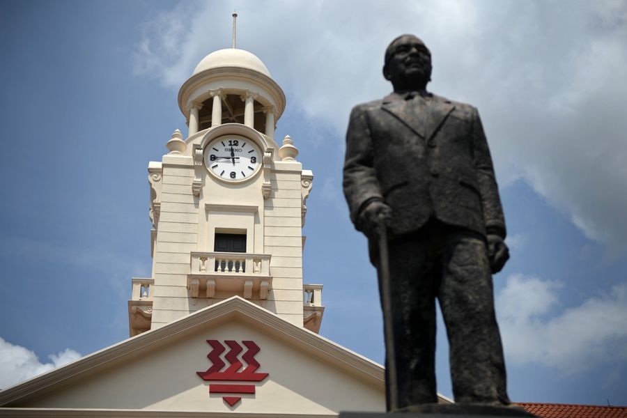 A statue of the school's founder, Tan Kah Kee, stands in front of the Hwa Chong clock tower. Hwa Chong clock tower was built in 1925 with generous donations from prominent Chinese leaders. (SPH)