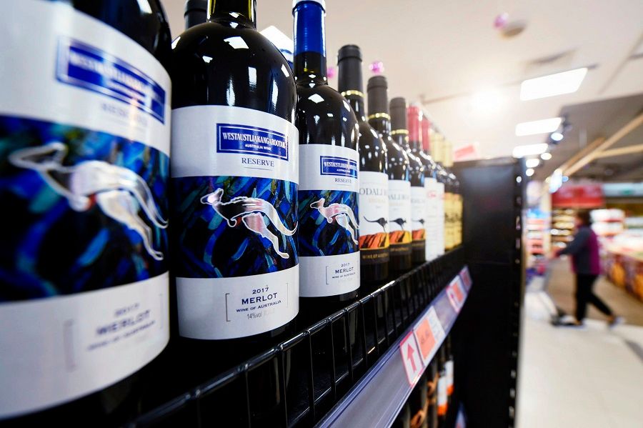 Bottles of Australian wine are displayed at a supermarket in Hangzhou, Zhejiang province, China, 27 November 2020. (STR/AFP)