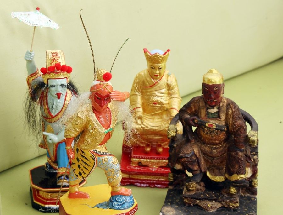 The Monkey God (second from left) among other figurines restored by Andy Yeo.
