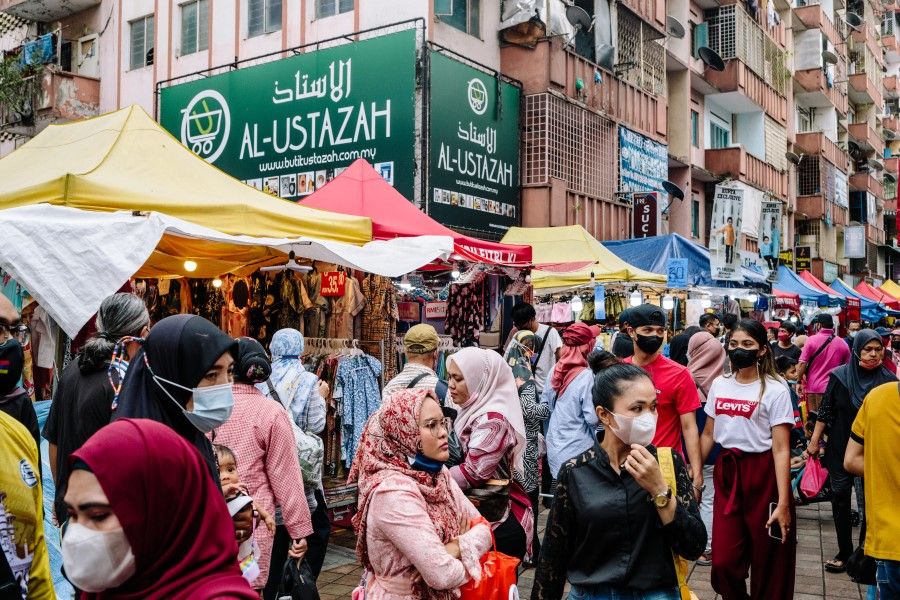 People in a market in Kuala Lumpur, Malaysia, on 1 May 2022. (Ian Teh/Bloomberg)