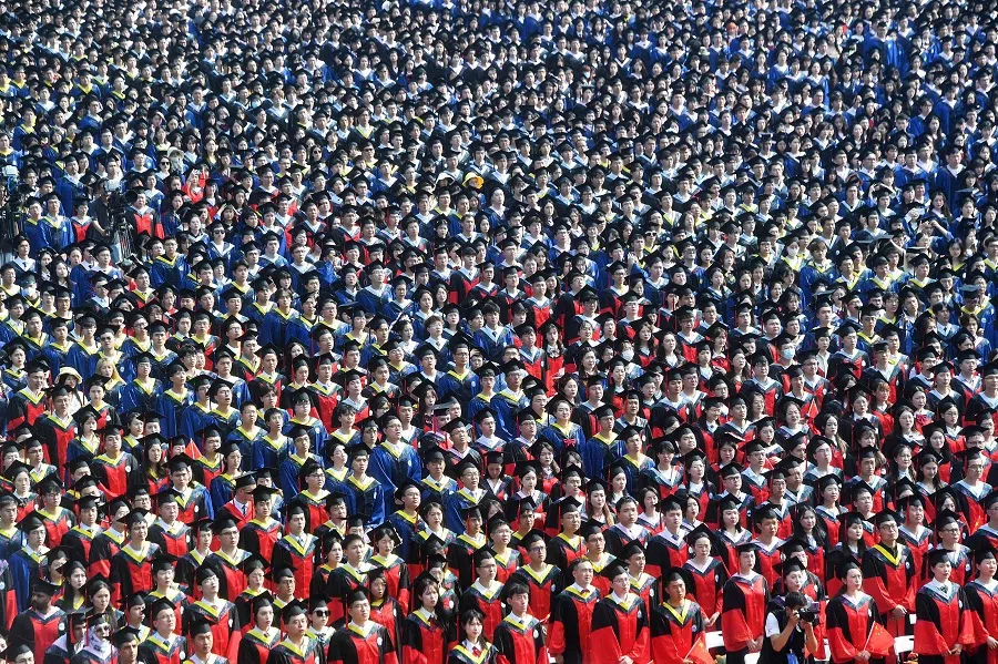 Graduates of Wuhan University attend their graduation ceremony on 20 June 2023. (AFP)