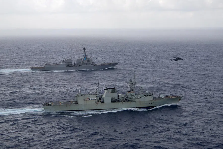 US Navy guided-missile destroyer USS Chung-Hoon sails alongside the Royal Canadian Navy frigate HMCS Montreal during Surface Action Group operations as a part of exercise “Noble Wolverine” in the South China Sea, on 30 May 2023.