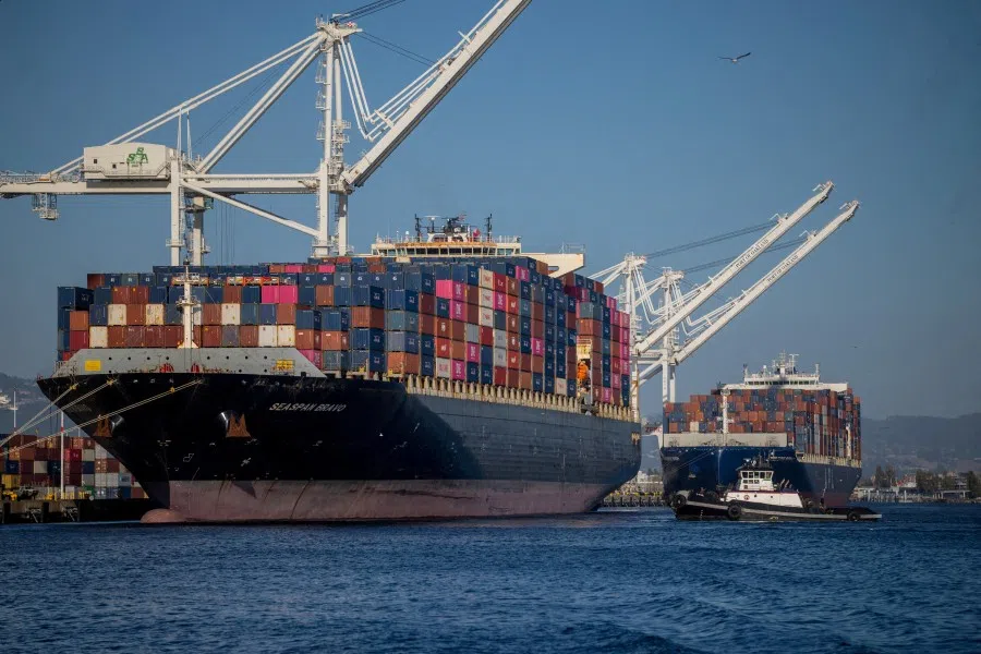 A cargo ship full of shipping containers is seen at the port of Oakland, California, US, 4 August 2025. (Carlos Barria/Reuters)