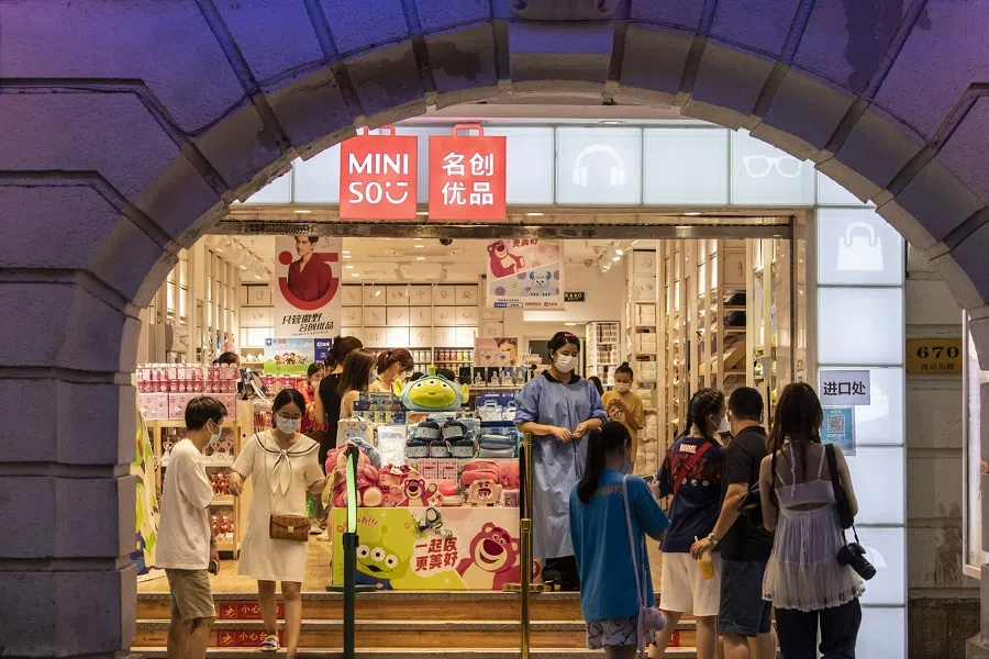 Shoppers browse through a Miniso store on Nanjing Road shopping street, in Shanghai, China, on 9 July 2022. (Qilai Shen/Bloomberg)