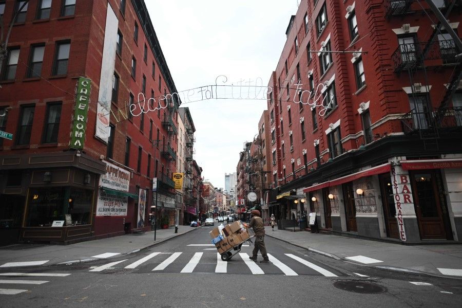 Closed shops and restaurants are seen in Manhattan's Little Italy in New York City, 17 March 2020. The coronavirus outbreak has hit many countries all over the world, with Italy and the US among the worst-hit countries. (Johannes Eisele/AFP)