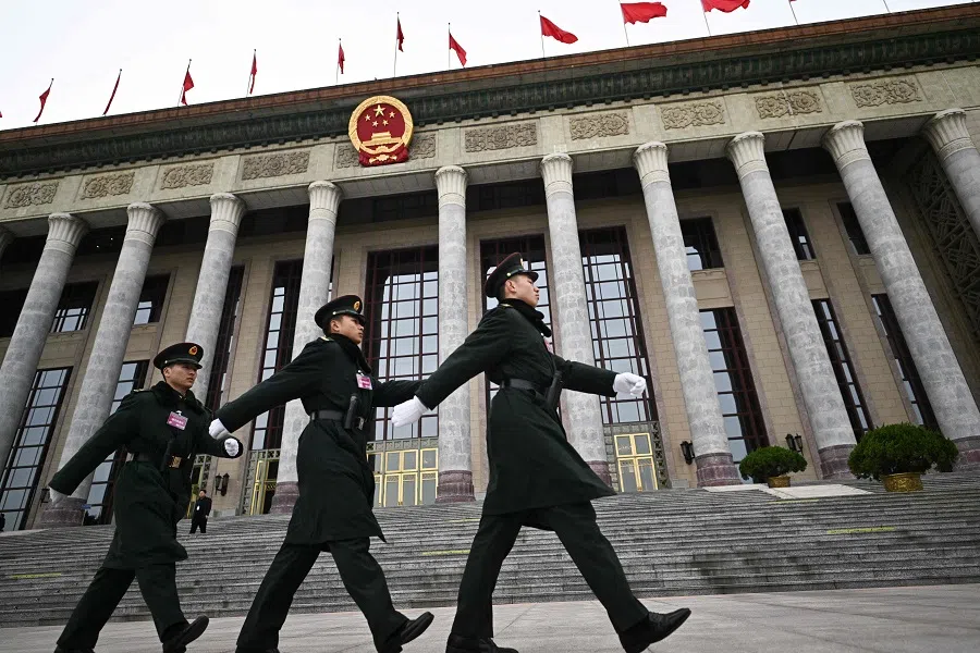 Chinese People’s Liberation Army (PLA) soldiers patrol outside the Great Hall of the People before a press conference for the Chinese People’s Political Consultative Conference (CPPCC) in Beijing on 3 March 2025, ahead of the country’s annual legislative meetings known as the “Two Sessions”. (Pedro Pardo/AFP)