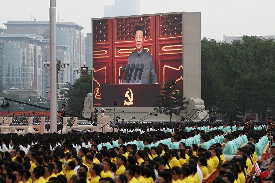 Chinese President Xi Jinping is seen on a giant screen as he delivers a speech at the event marking the 100th founding anniversary of the Communist Party of China, on Tiananmen Square in Beijing, China, 1 July 2021. (Carlos Garcia Rawlins/File Photo/Reuters)
