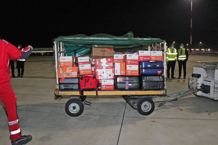 This photo provided by Italian news agency Ansa on 13 March 2020 shows supplies being unloaded after a China Eastern flight bringing medical supply from China landed on 13 March at Rome's Fiumicino international airport from Shanghai, to help fight the new coronavirus in Italy. (STRINGER/ANSA/AFP)