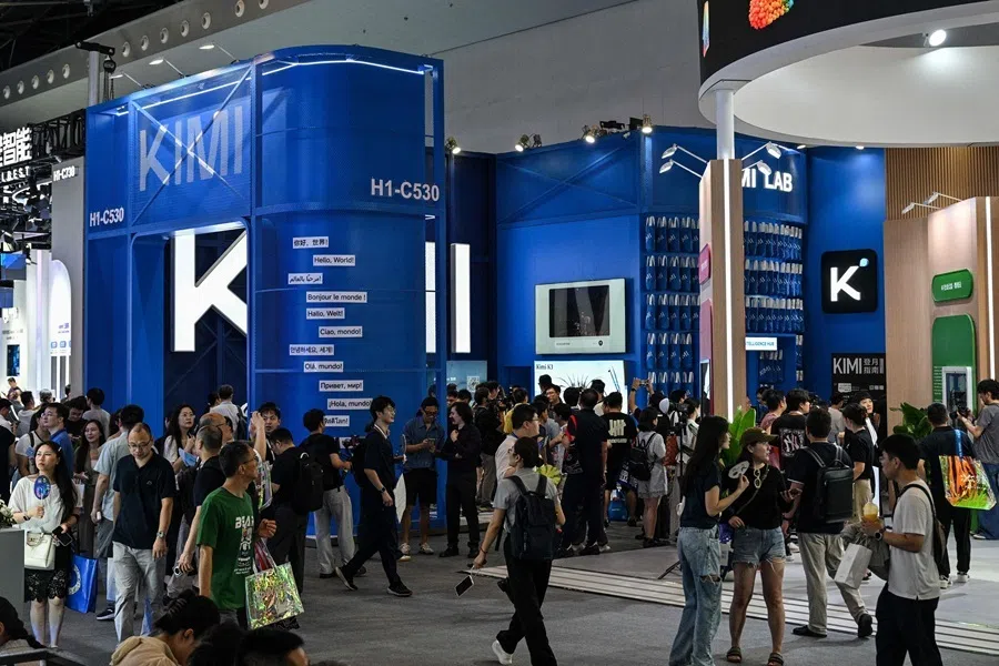 People visit the Moonshot AI stand, featuring the Kimi K3 model, during the World Artificial Intelligence Conference (WAIC) in Shanghai on 18 July 2026.