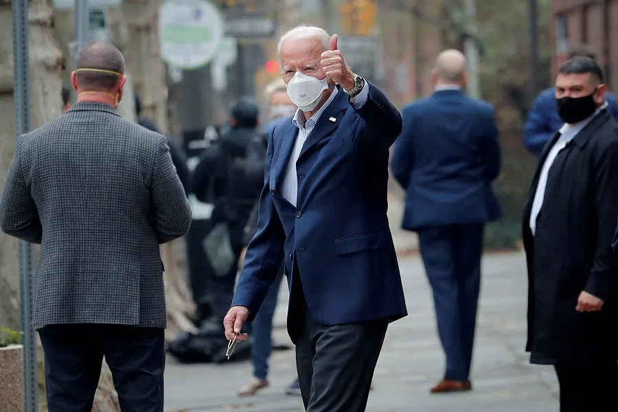 US President-elect Joe Biden gestures as he exits Penn Medicine Pennsylvania Hospital in Philadelphia, Pennsylvania, US, 12 December 2020. (Mike Segar/Reuters)