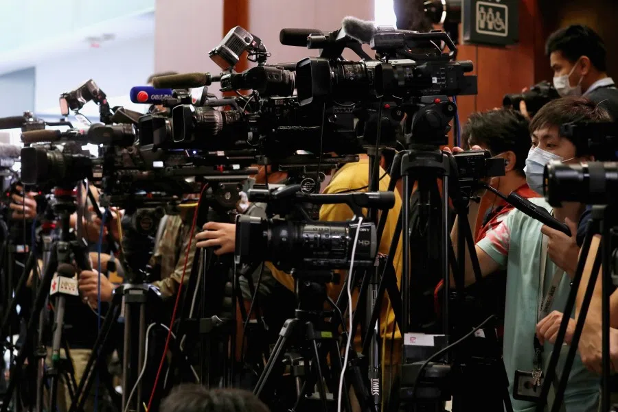 Journalists at the Legislative Council, following the outbreak of the new coronavirus, in Hong Kong, February 26, 2020. There are concerns that mainland China's expulsion of US journalists, and prohibiting them from working in Hong Kong and Macau, will threaten the "one country, two systems" principle. (Tyrone Siu/REUTERS)