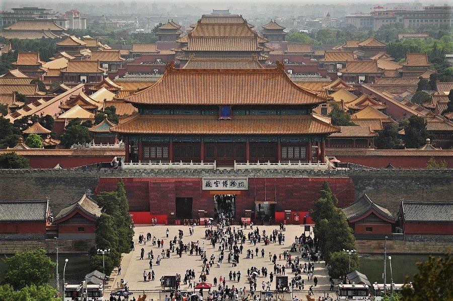 People visit the Forbidden City in Beijing, China, 3 May 2021. (Noel Celis/AFP)