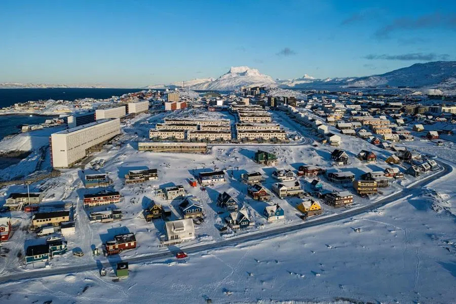 This aerial view image shows the city of Nuuk covered in snow along the coastline of western Greenland, on 20 January 2026.