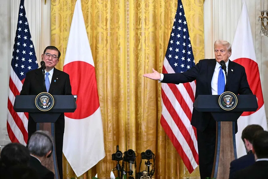 US President Donald Trump (right) and Japanese Prime Minister Shigeru Ishiba hold a joint press conference following talks, in the East Room of the White House in Washington, DC, on 7 February 2025.