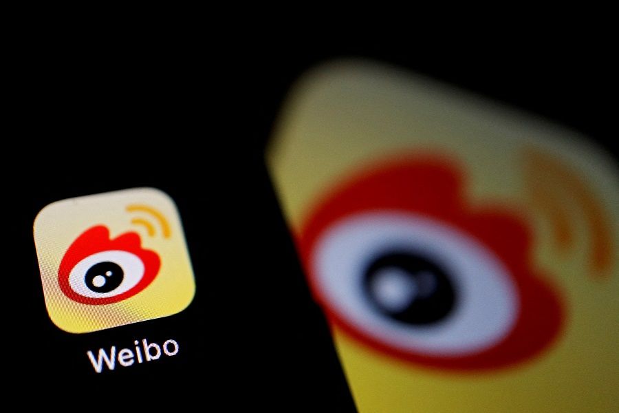 The logo of Chinese social media app Weibo is seen on a mobile phone in this illustration picture taken on 7 December 2021. (Florence Lo/Illustration/File Photo/Reuters)