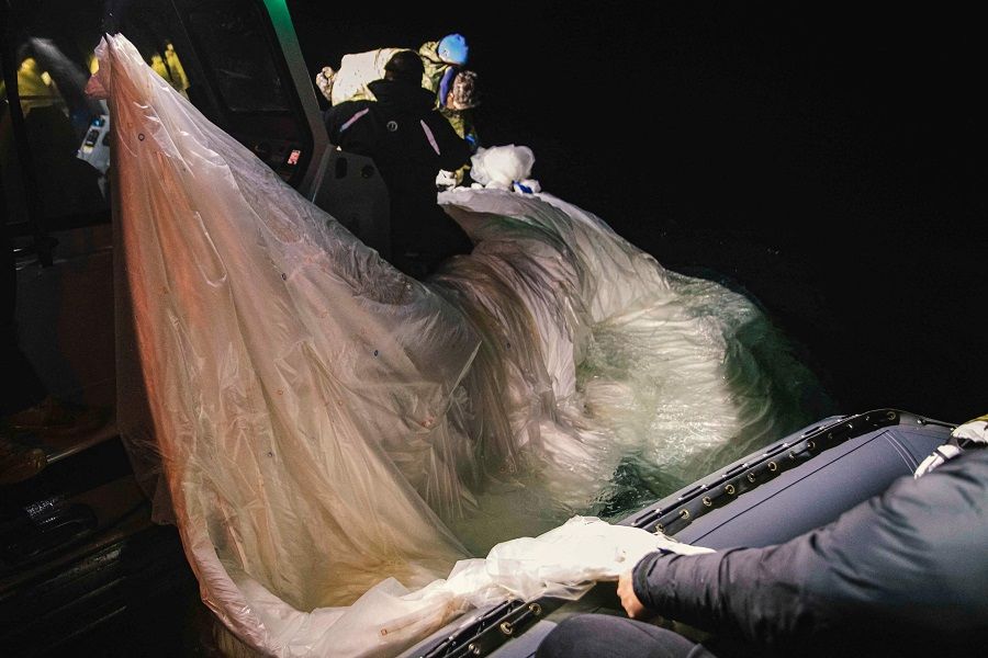 This picture provided by the US Navy shows sailors recovering a Chinese balloon off the coast of Myrtle Beach, South Carolina, in the Atlantic ocean on 5 February 2023. (Petty Officer 1st Class Tyler Thompson/US Navy/AFP)