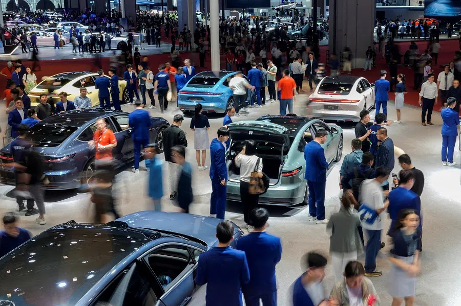 People visit various booths at the Auto Shanghai show, in Shanghai, China, on 19 April 2023. (Aly Song/File Photo/Reuters)