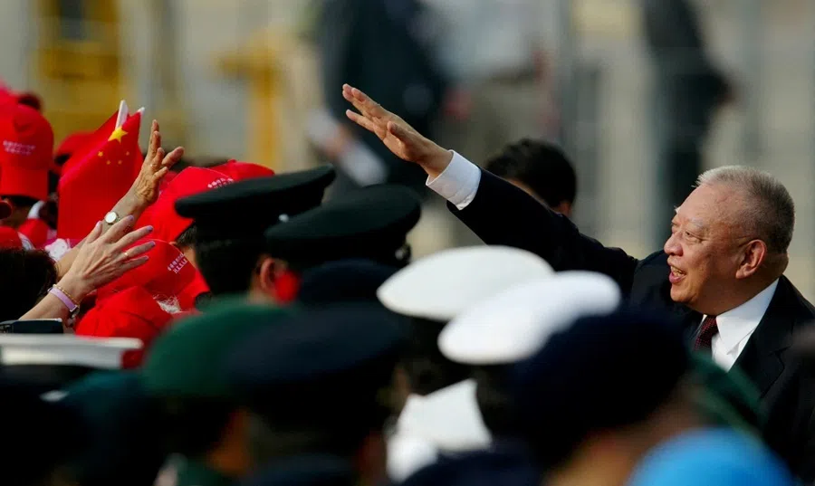 Hong Kong Chief Executive Tung Chee-hwa waves to residents as they attend a flag raising ceremony to mark the seventh anniversary of the handover of Hong Kong to China, in Hong Kong, China, on 1 July 2004.