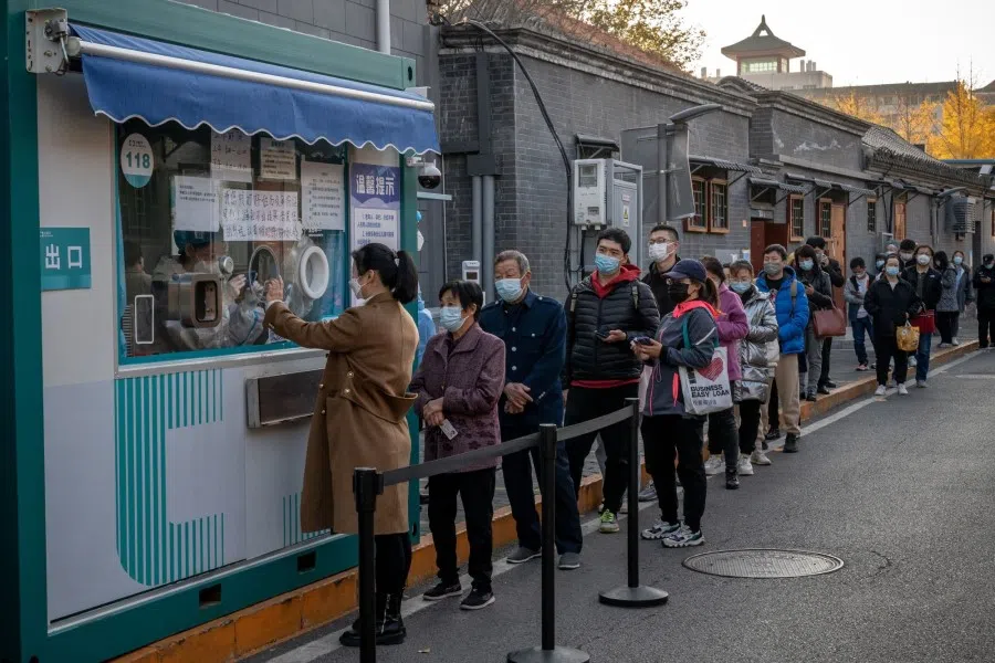 Residents at a Covid-19 testing booth in Beijing, China, on 14 November 2022. (Bloomberg)