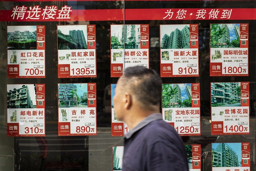 Listings of apartments for sale displayed at a real estate office in Shanghai, China, on 30 August 2021. (Qilai Shen/Bloomberg)