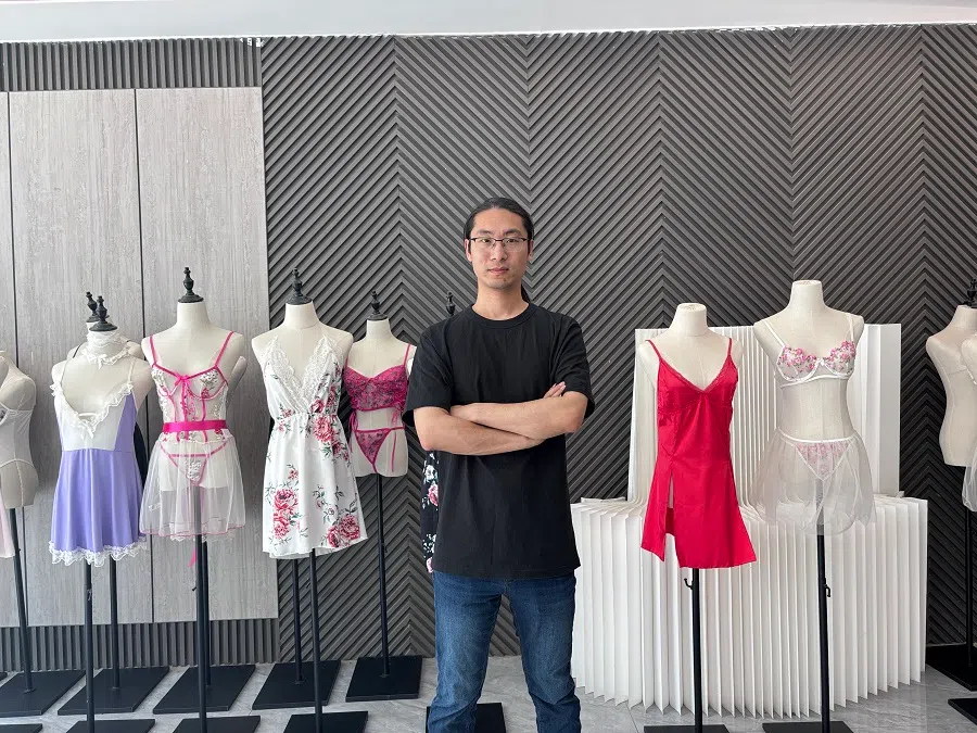 Lei Congrui, known as “the prince of lingerie” among Guanyun locals, poses in front of his products.