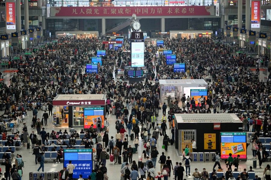 Passengers wait to board trains at Shanghai Hongqiao railway station ahead of the five-day Labour Day holiday, in Shanghai, China, 28 April 2023. (Aly Song/Reuters)