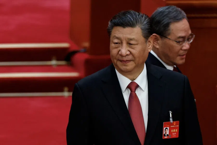 Chinese President Xi Jinping and Premier Li Qiang arrive for the closing session of the National People's Congress (NPC) at the Great Hall of the People in Beijing, China, on 11 March 2024. (Tingshu Wang/Reuters)