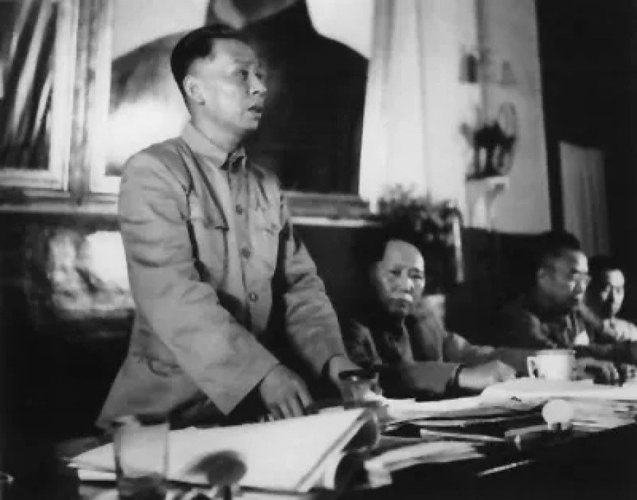 Liu Shaoqi speaking on land reform at the third plenary session of the 7th Chinese Communist Party Central Committee, 1950. Beside him is Mao Zedong. (Wikimedia)