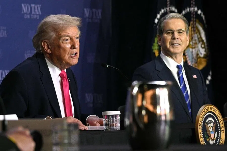 US President Donald Trump (left) speaks, flanked by US Secretary of Treasury Scott Bessent, during a roundtable discussion on his "no tax on tips" policy at the AC Hotel Las Vegas Symphony Park in Las Vegas, Nevada, on 16 April 2026. (Jim Watson/AFP)