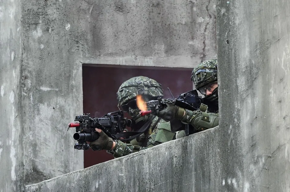 This file photo taken on 6 January 2022 shows Taiwanese soldiers taking part in a drill at an army base in Kaohsiung, Taiwan. (Sam Yeh/AFP)
