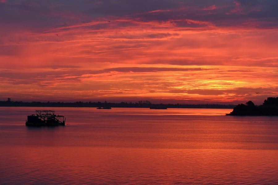Sunrise is pictured over the Mekong River on the outskirts of Phnom Penh, 1 June 2020. (Tang Chhin Sothy/AFP)