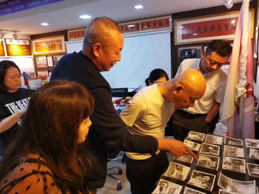 In May 2023, Sian Chay Medical Institution’s executive chairman Toh Soon Huat reviewed high-quality archival photographs needed for the picture book.